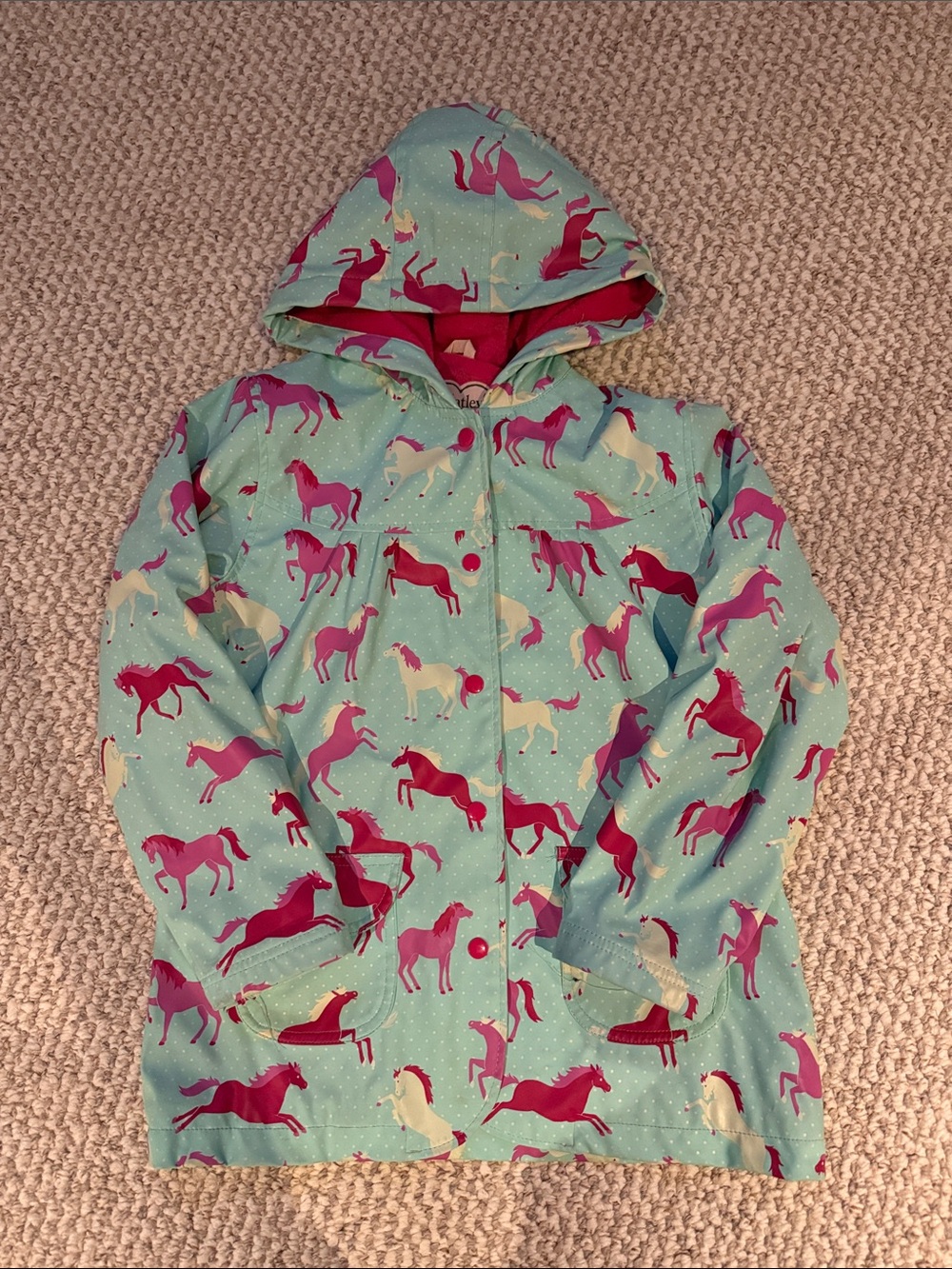 Hatley Aqua Hooded Raincoat with Pink & Cream Horse Print and lined interior